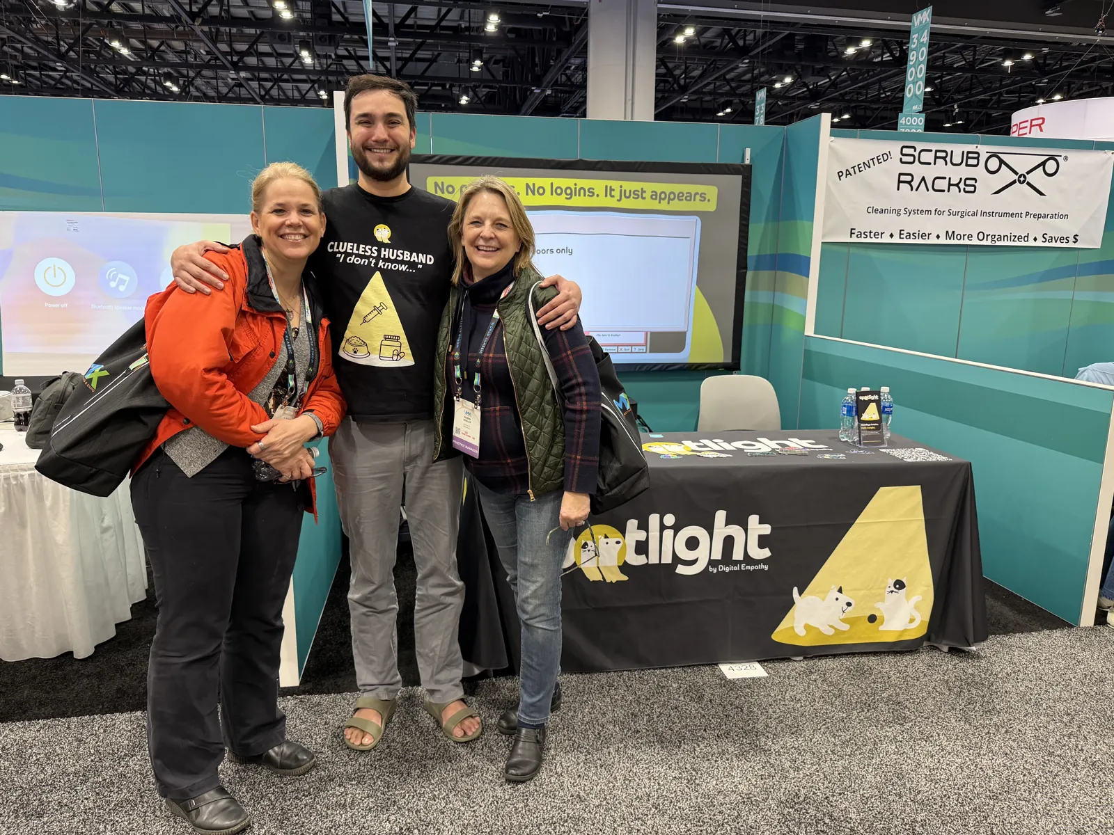 Robert Sanchez with two clients from Bryant Mobile Veterinary Care at the Digital Empathy booth at VMX 2026